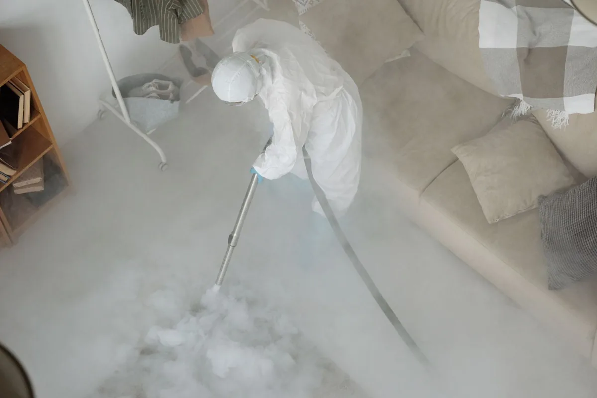 Biohazard cleanup technician in protective equipment, Millerton, CA